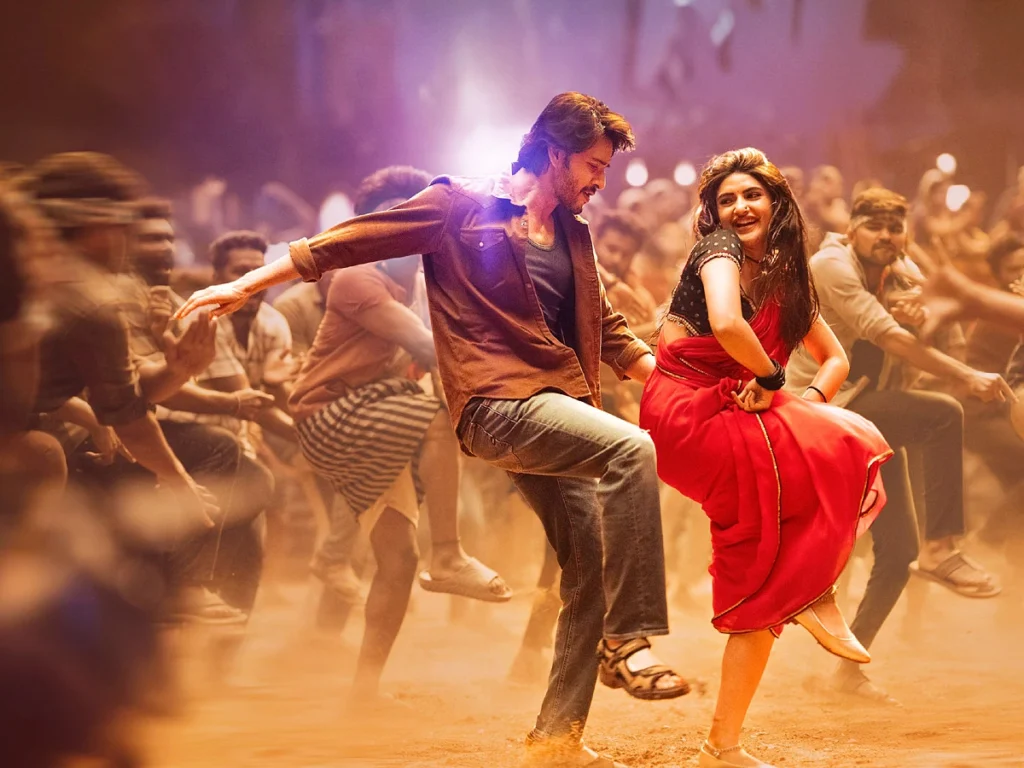 A still from Kurchi Madathapetti showing the two leads dancing